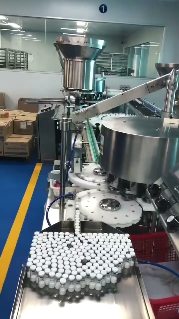 Automated vial-handling equipment in a production workspace